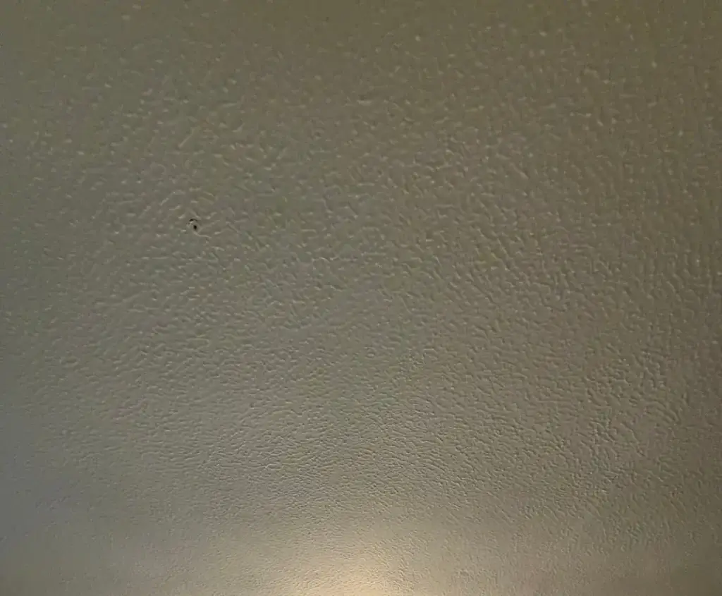 Textured Artex ceiling before asbestos removal by SafeZone Asbestos Solutions