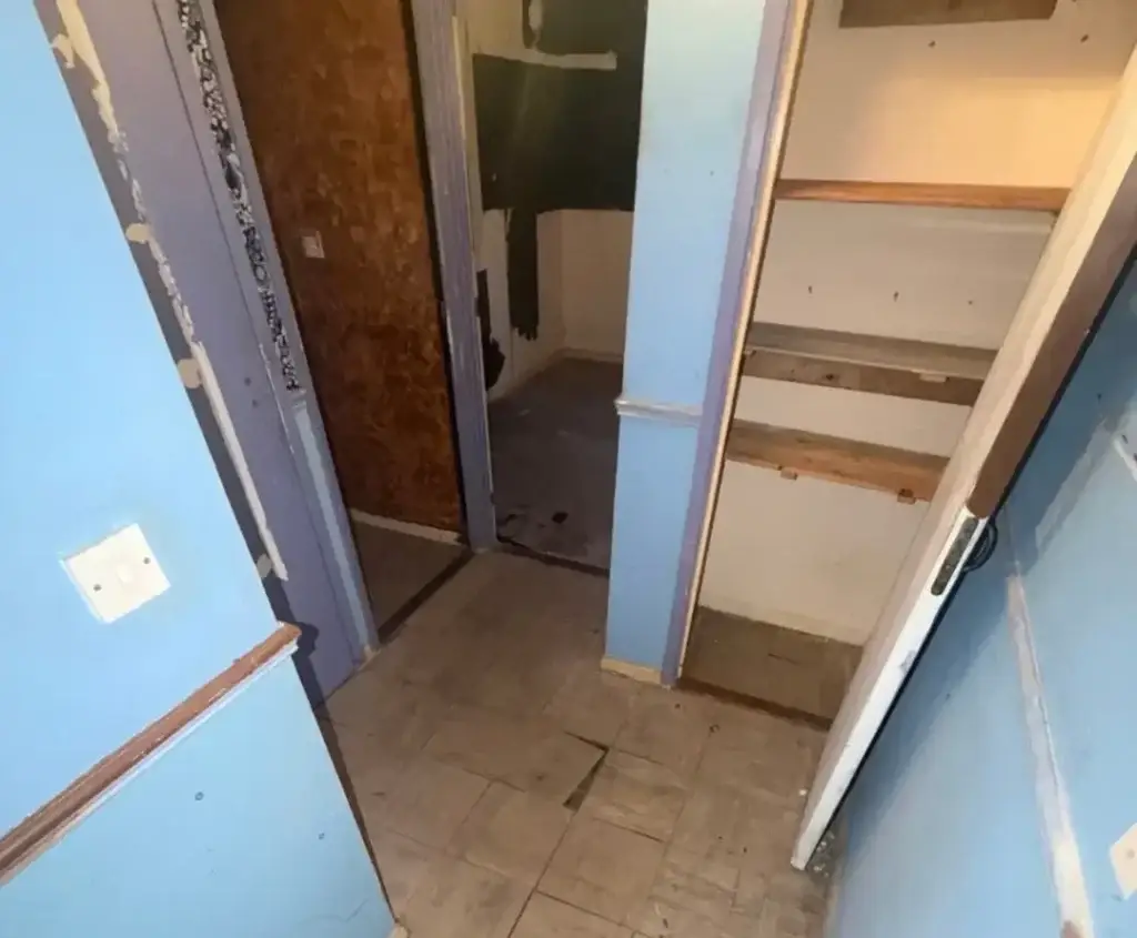 Hallway with asbestos floor tiles before removal by SafeZone Asbestos Solutions